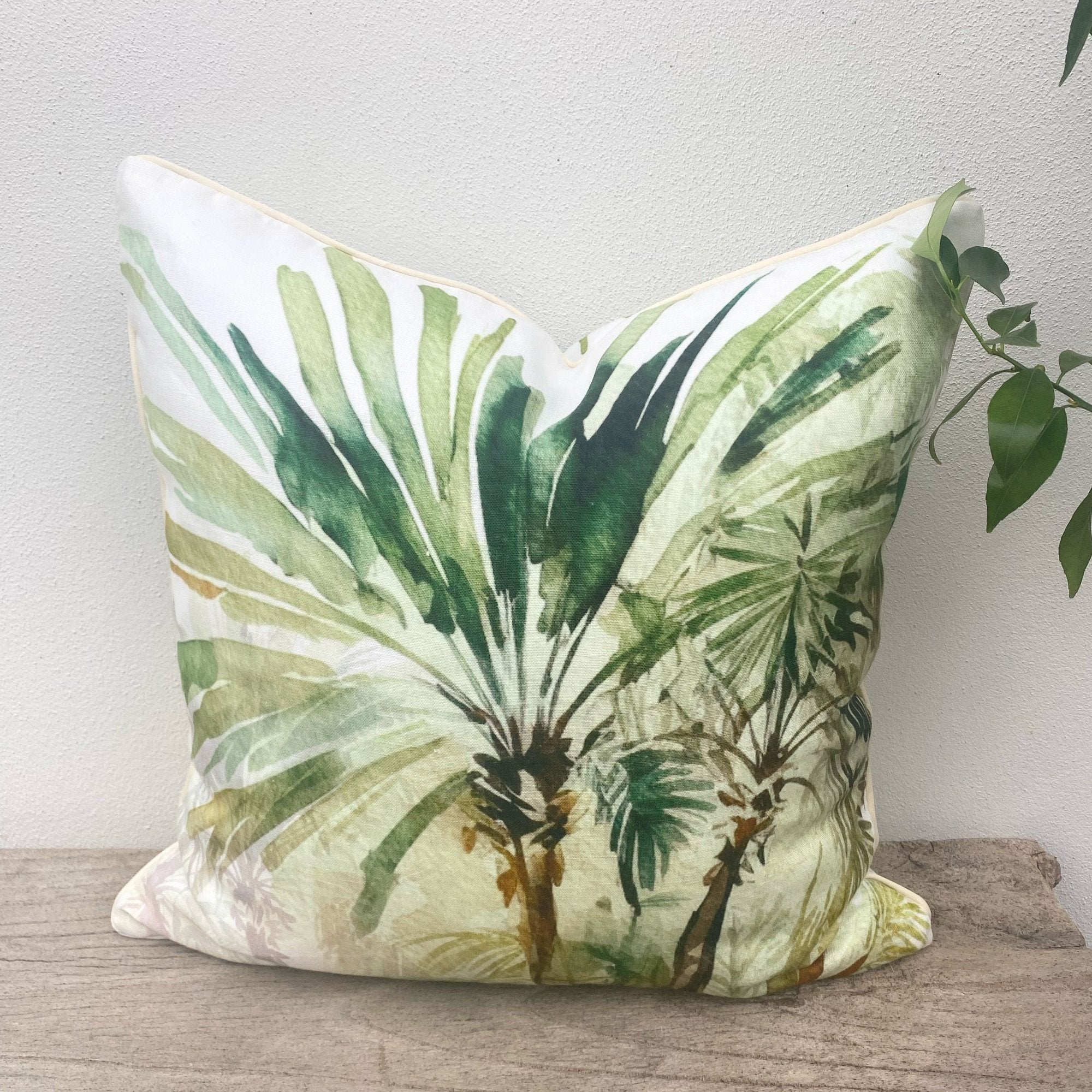 A stunning watercolour palm tree green linen cushion.