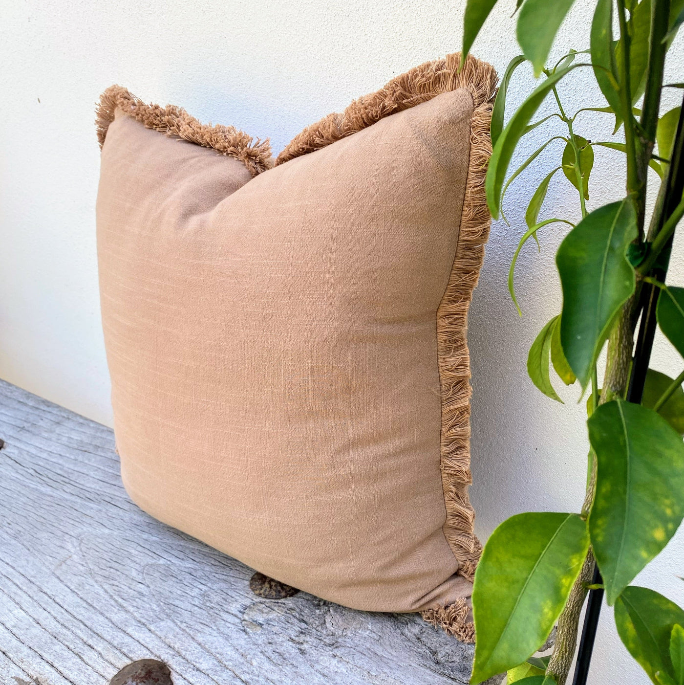 Large-rust-coloured-cushion-with-fringed-edge