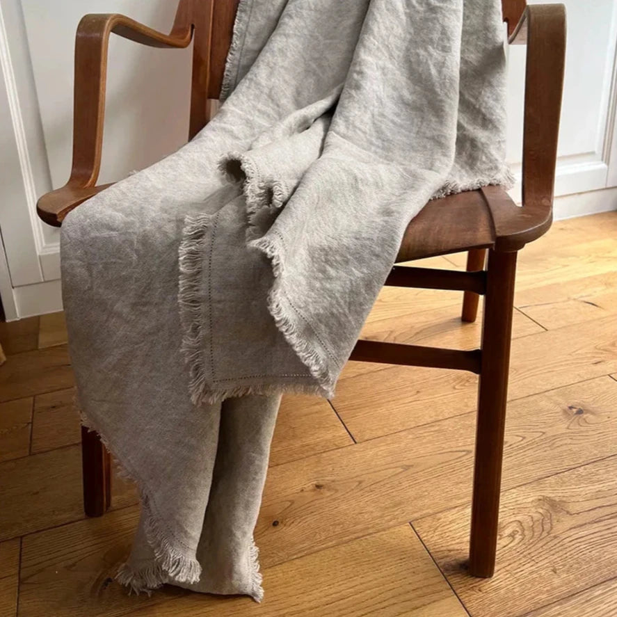 Natural Pure French Linen Throw Blanket Draped Over a Chair